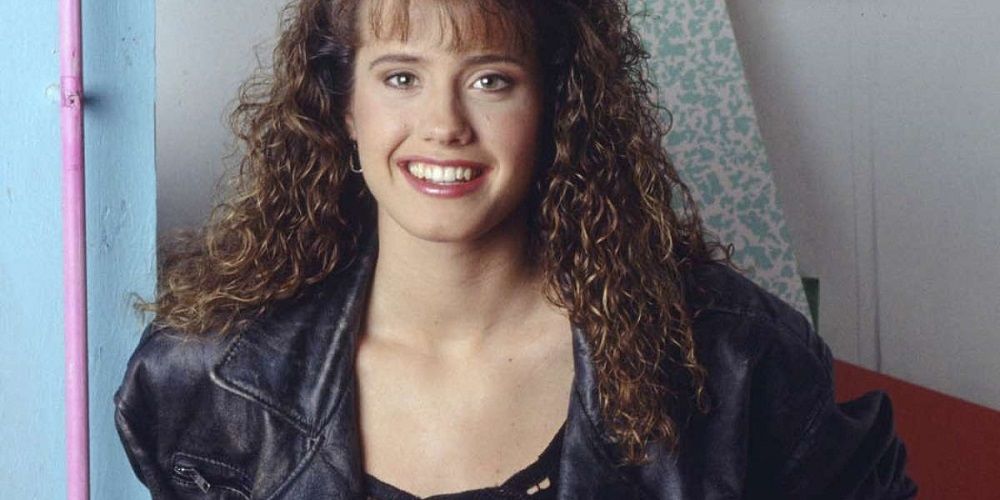 Tori poses in leather jacket in Saved By the Bell