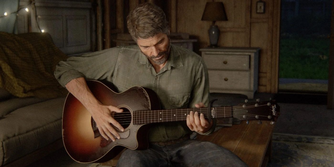 Joel playing guitar in a dimly-lit room in The Last of Us Part 2.
