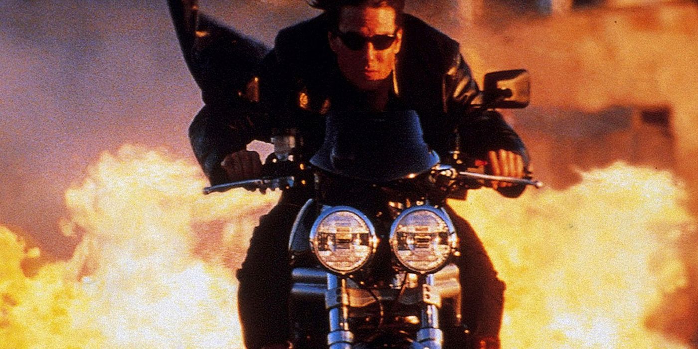 Tom Cruise riding a motorcycle away from flames in MI 2