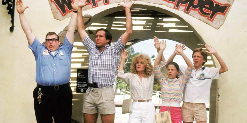The Griswolds hold hands in air outside of Wally World in Vacation