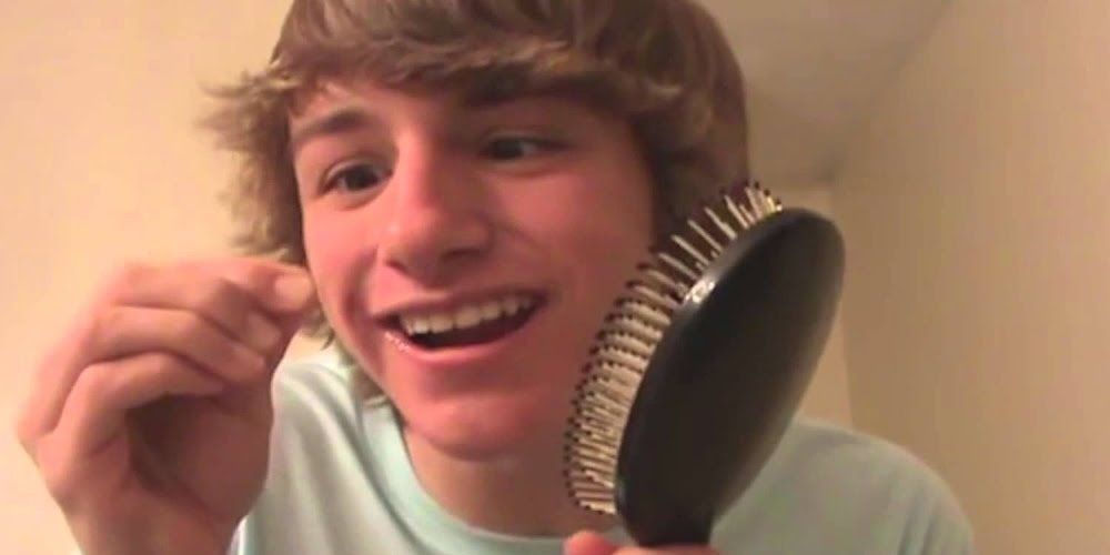 YouTube's Fred Figglehorn holding a brush.