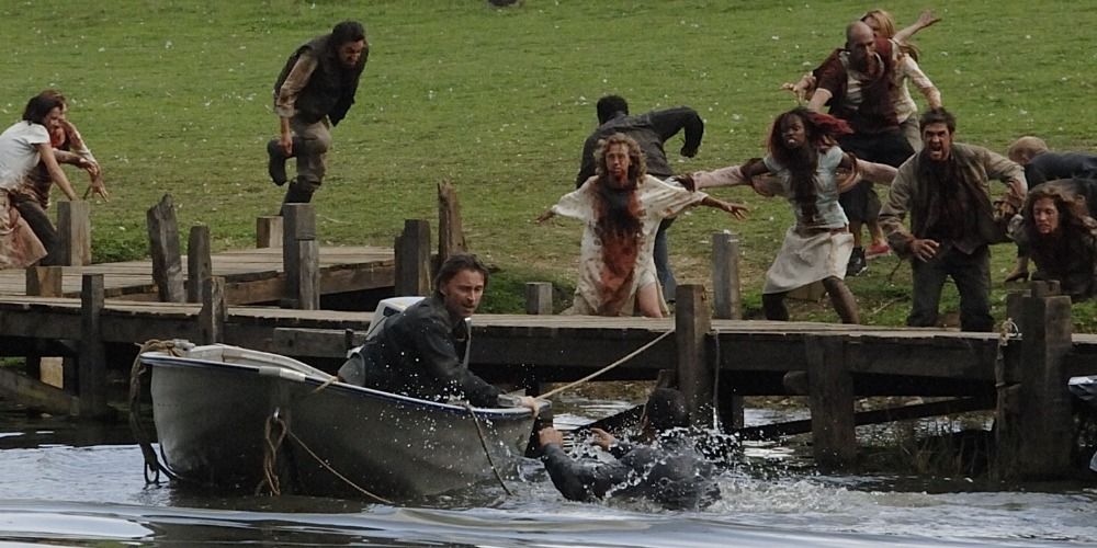 Don escaping in a small boat while zombies try to catch up with him in a scene from 28 Weeks Later