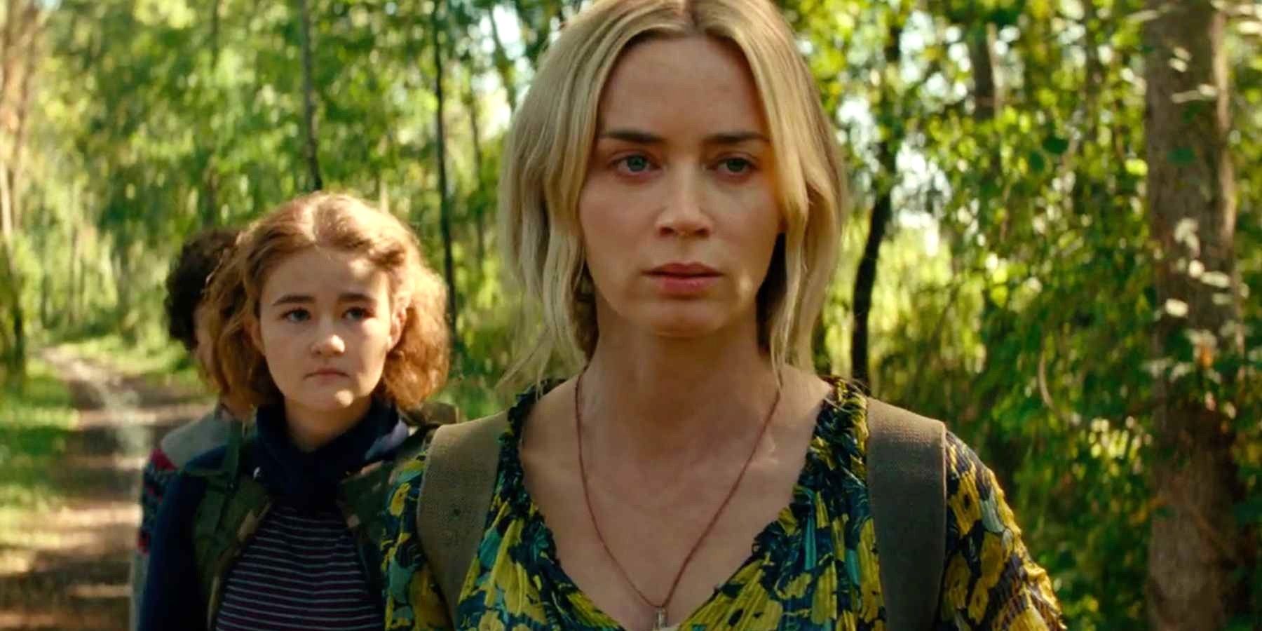 Evelyn, Regan, and Noah walking down a path in A Quiet Place Part II