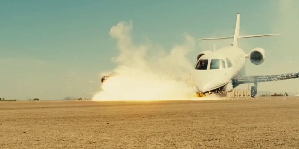 A car crashes into a plane in a still from Taken 3 