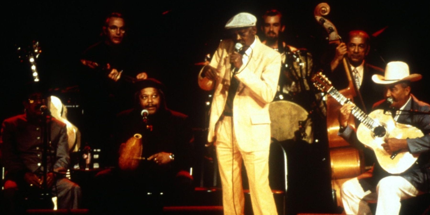 A group of Cuban musicians performing on stage in a still from Buena Vista Social Club 