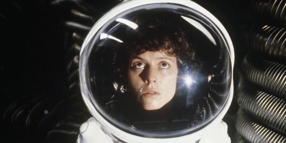 A woman wearing a space suit and looking up in Alien.
