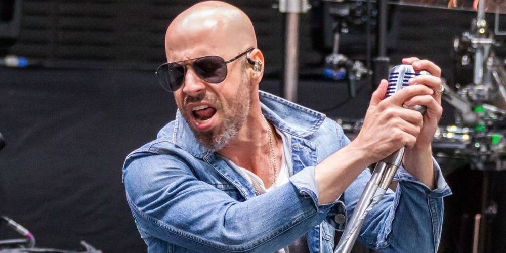 Daughtry wearing sunglasses and holding microphone