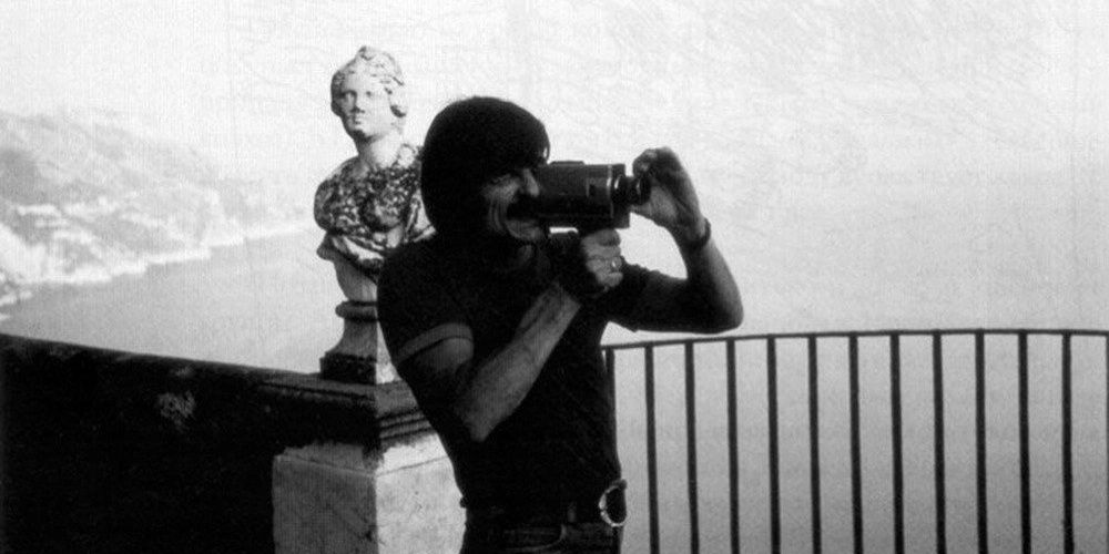 Andrei Tarkovsky shooting on a handheld camera in a still from Voyage In Time