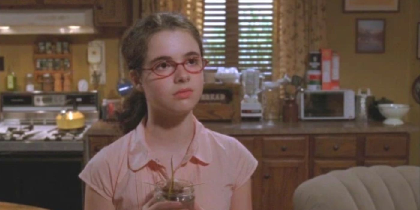 April Nardini holding on to her avocado plant on Gilmore Girls