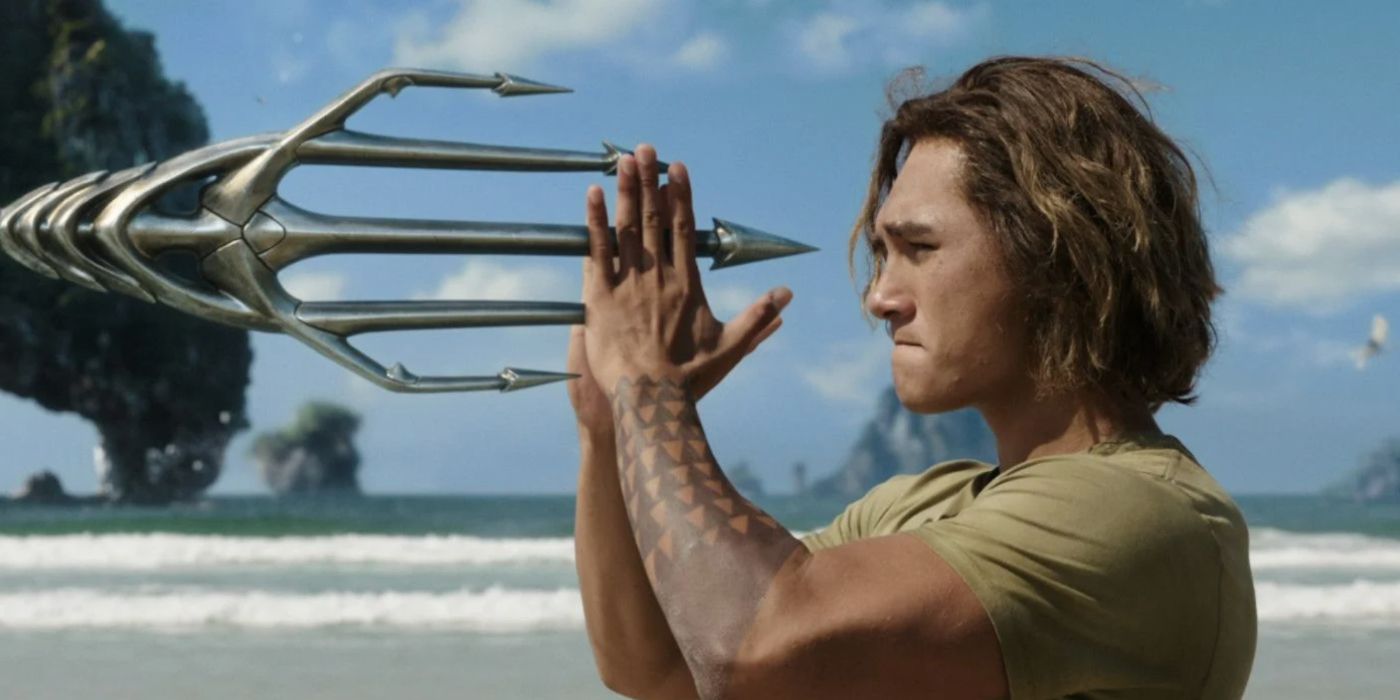 A young Arthur Curry holding a trident in in Aquaman 