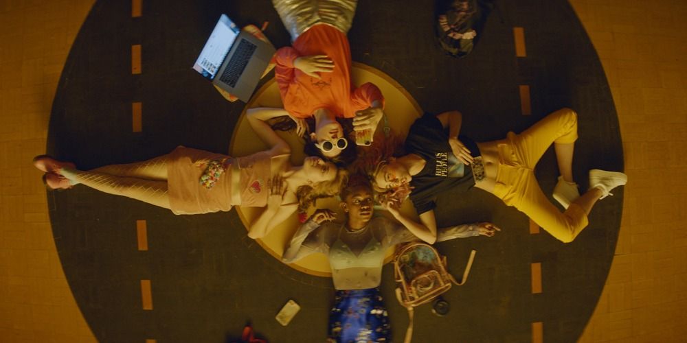 Lily, Em, Sarah and Bex lying in a circle in a scene from Assassination Nation