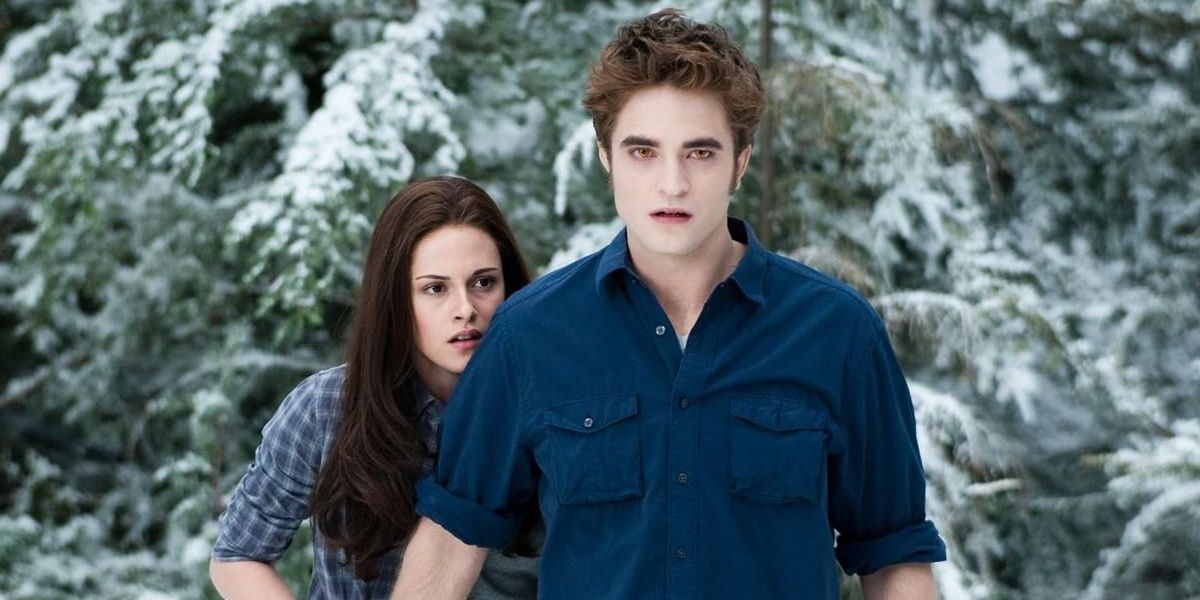 Bella hiding behind Edward