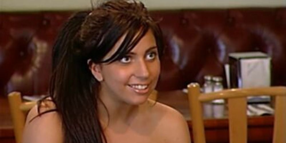 Lady Gaga smiling at someone off camera in an episode of Boiling Points