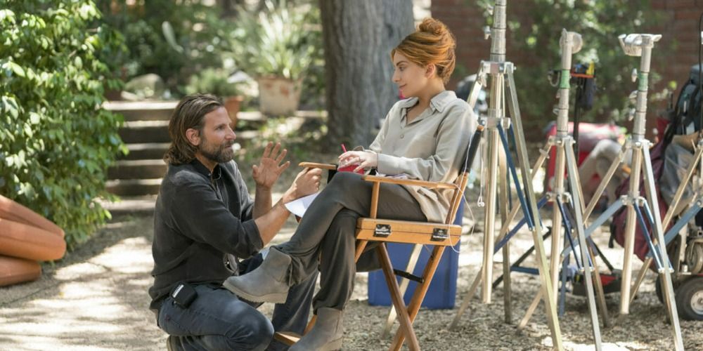 Bradley Cooper kneeled in front of Lady Gaga on the set of A Star is Born