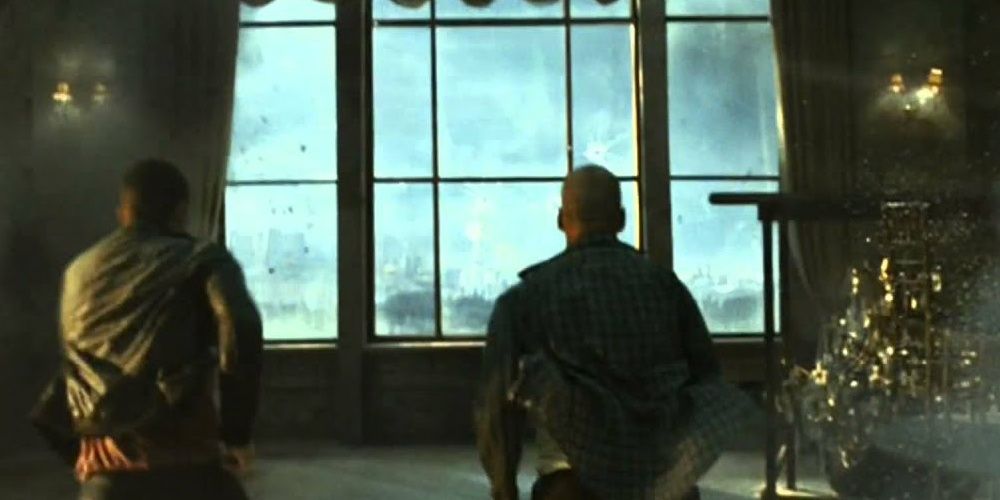 Bruce Willis and Jai Courtney run towards a window in A Good Day To Die Hard 