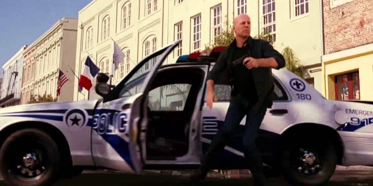 Bruce Willis escapes a moving cop car in RED