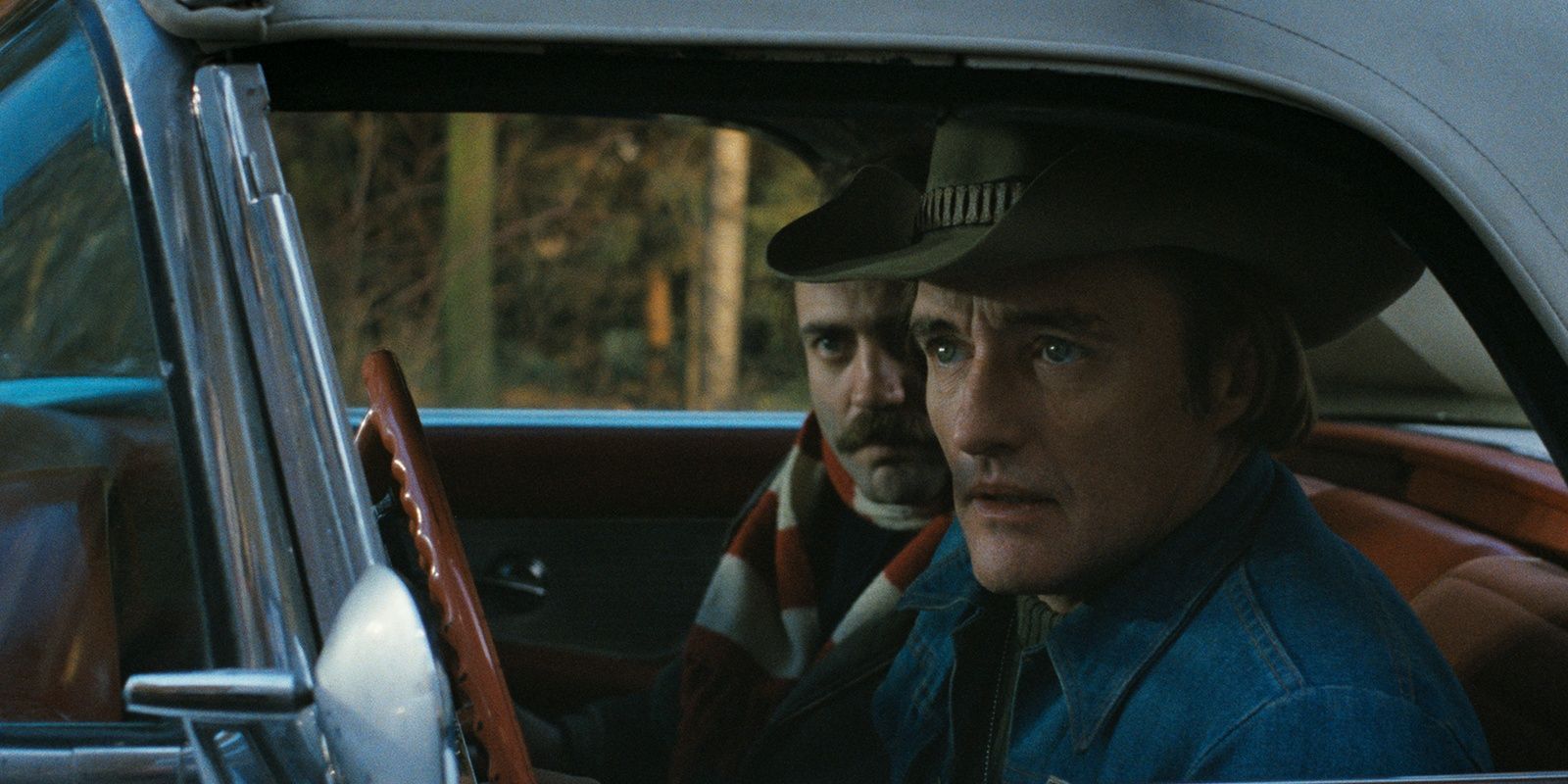 Bruno Ganz and Dennis Hopper sitting in a car in a still from The American Friend 
