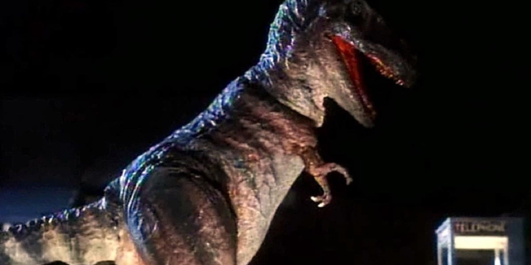 A T-Rex about to attack a phone booth in Carnosaur