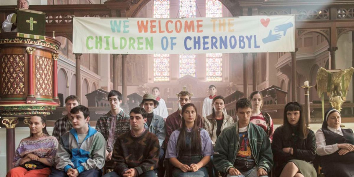 Children from Chernobyl seated at the school assembly in a still from Derry Girls