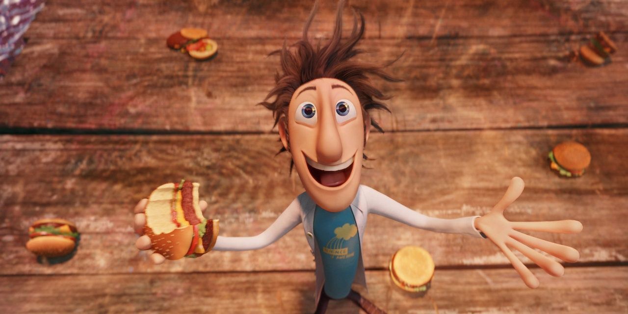 Flint looking up excitedly with a burger in his hand in Cloudy with a Chance of Meatballs