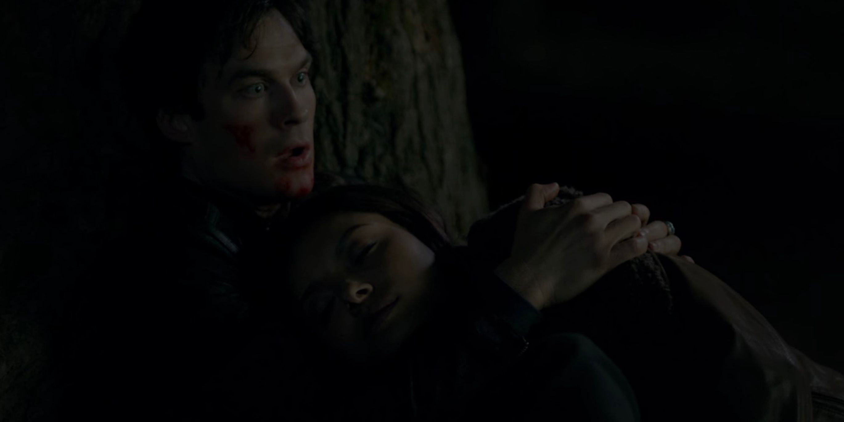Damon holds Bonnie in The Vampire Diaries.
