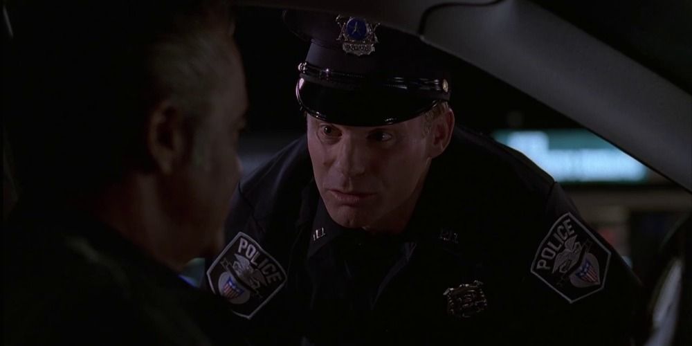 Officer Danny stops Paulie to take a bribe