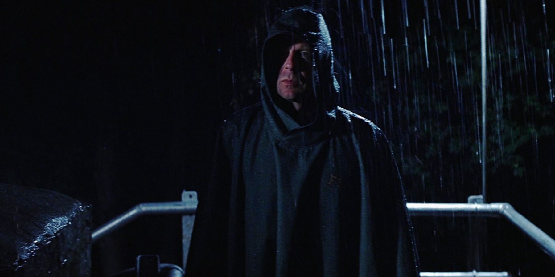 David Dunn as Overseer standing in the rain in Unbreakable