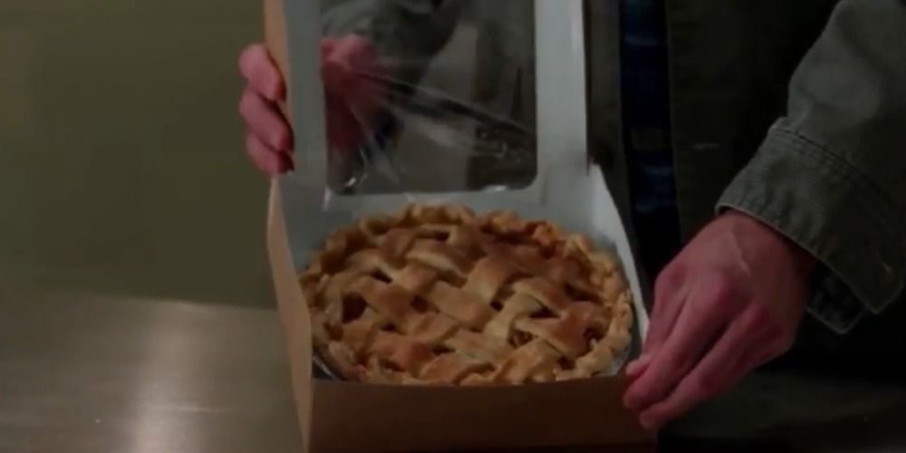 Dean buys a pie and shows it off to Sam in Supernatural