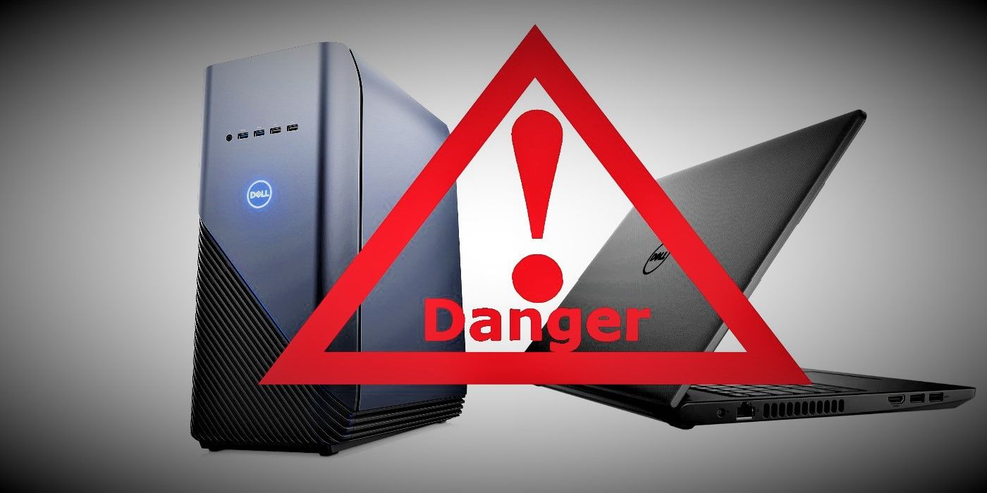 Dell desktop PC and Inspiron laptop behind danger warning symbol