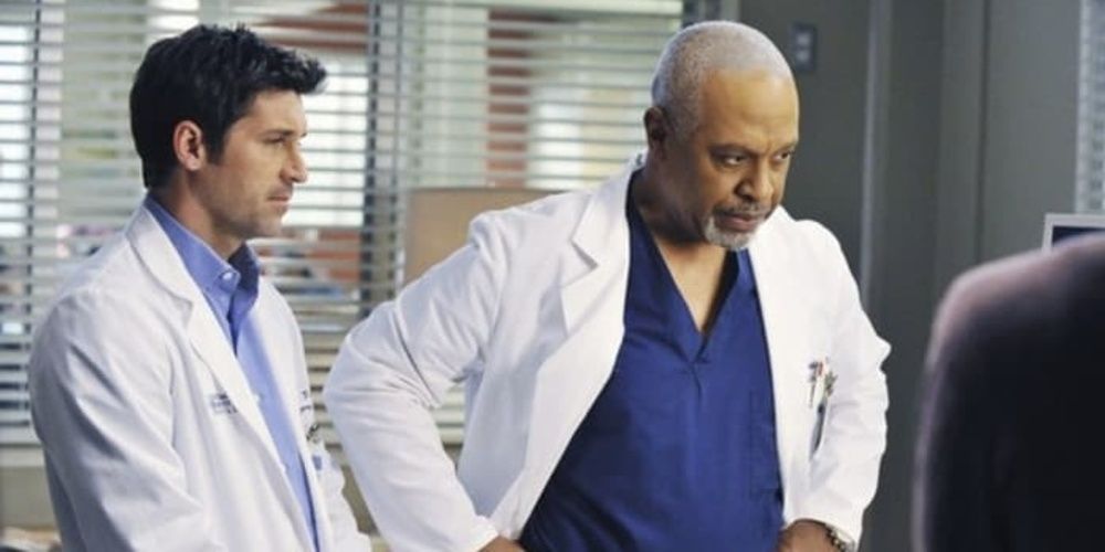 Derek and Richard talk to a patient