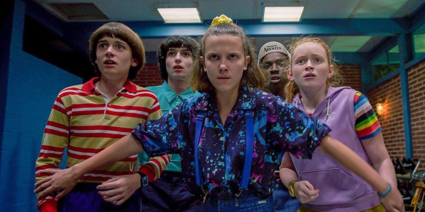 Eleven stands in front of Will, Mike, Max, and Lucas protectively