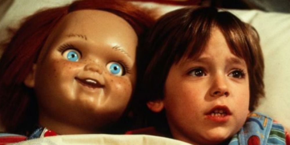 Child and Chucky in bed in Child's Play