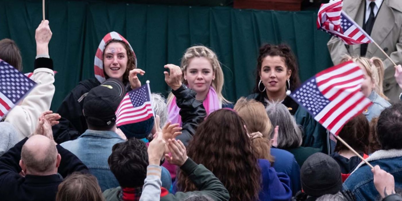 Erin and friends at a parade welcoming Bill Clinton in Derry Girls