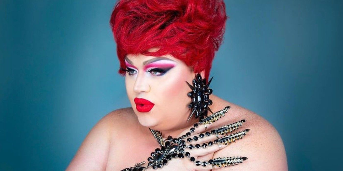 Eureka poses for a photo with her hand on her shoulder