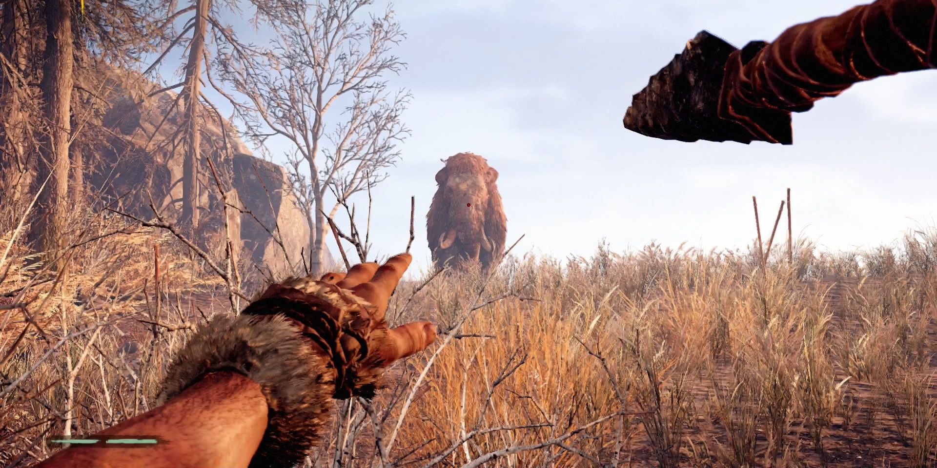 Takkar aims a spear at an incoming woolly mammoth in Far Cry.