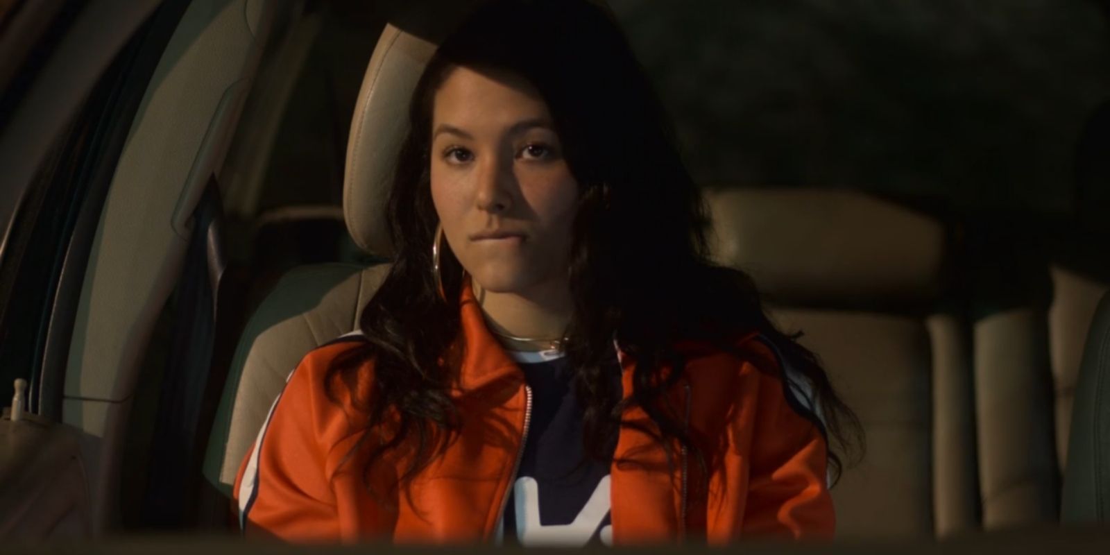 Izzie looks confused in the passenger seat of Casey's car in Atypical