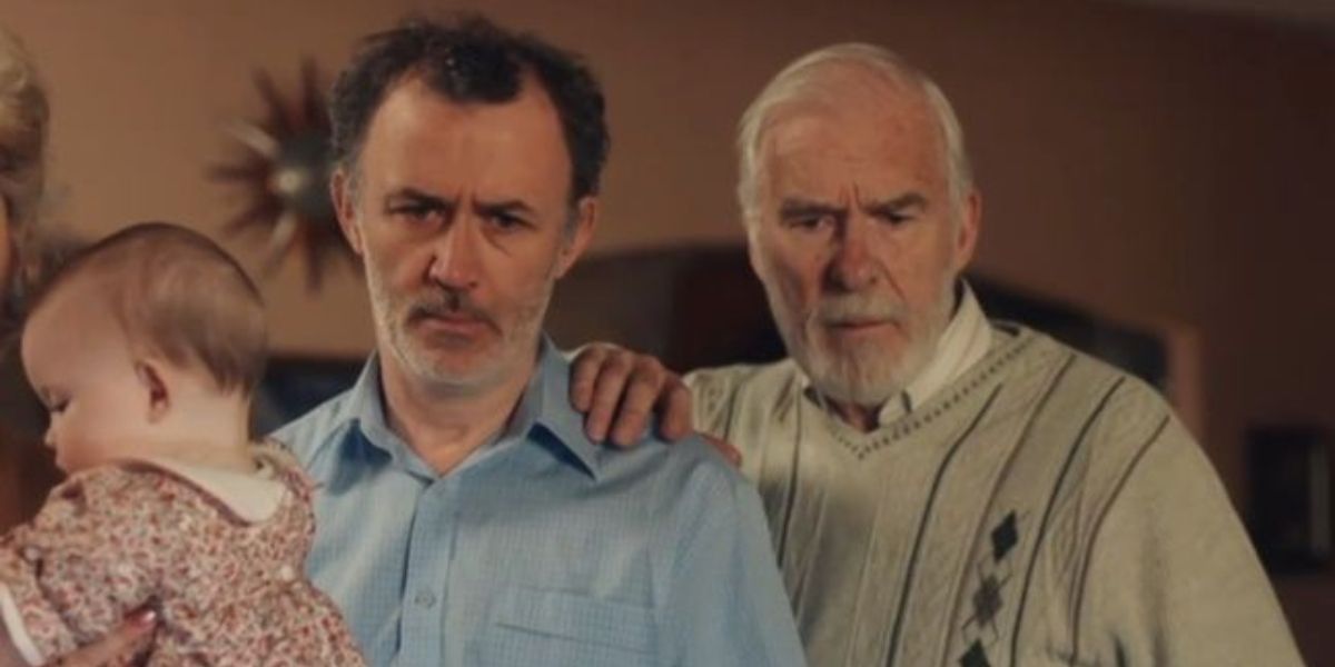 Final shot of Derry Girls finale featuring an old man holding the shoulder of his son-in-law