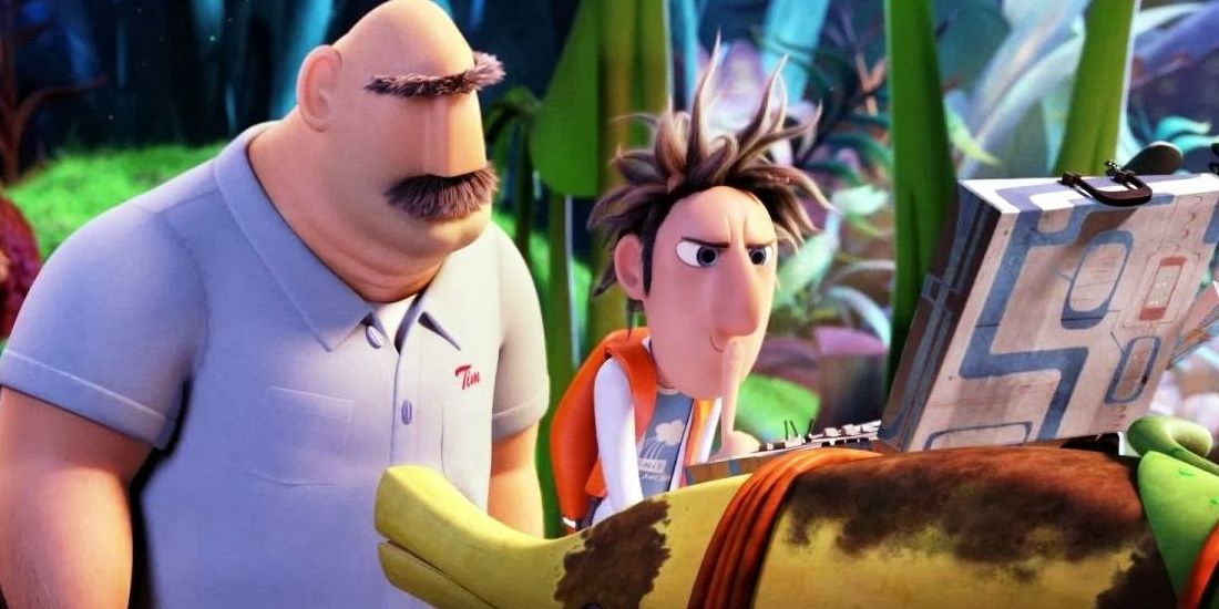 Flint with his father working on a laptop in a still from Cloudy With a Chance of Meatballs
