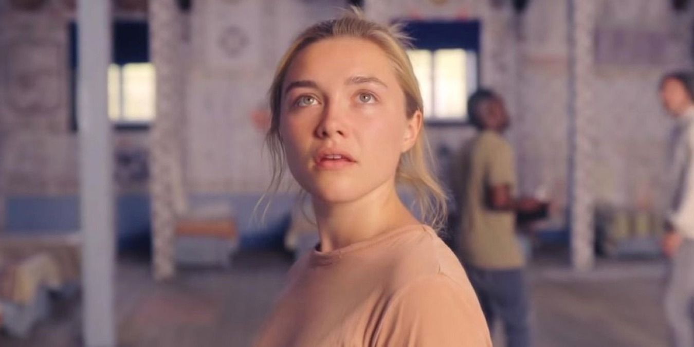 Florence Pugh as Dani, standing in the house in Sweden in Midsommar