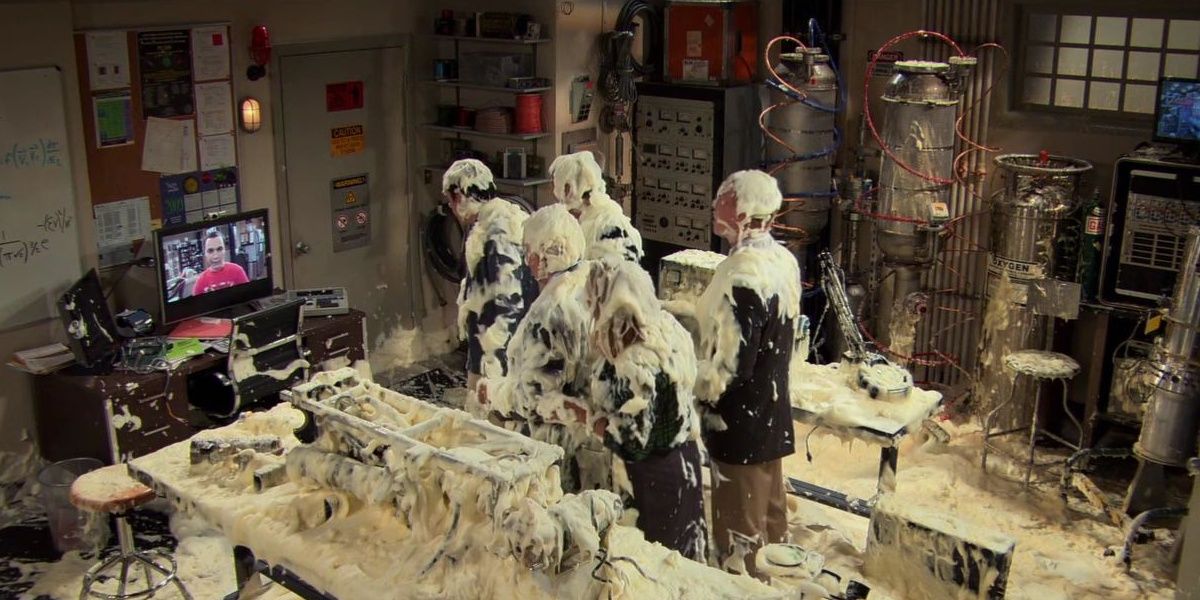 Kripke and other university officials covered in foam in The Big Bang Theory