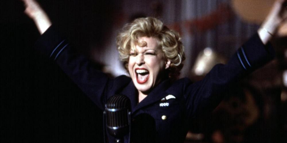 Dixie Leonard screaming with her arms up in a scene from For The Boys