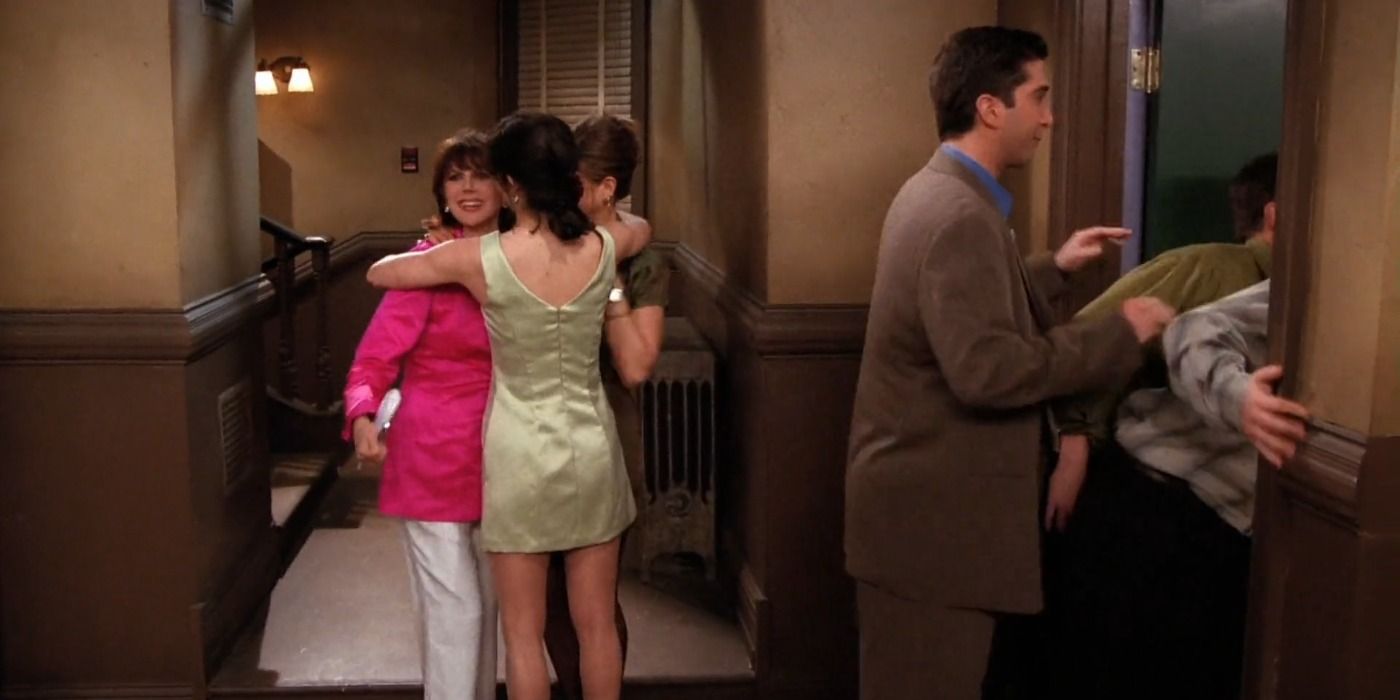 Monica and Rachel hug Sandra Green in the hallway and Ross peeps into their apartment in Friends