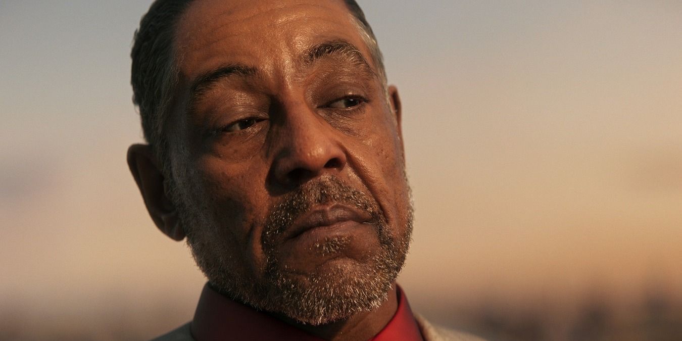 Giancarlo Esposito as Anton in the new Far Cry 6, standing in an open field with the sun setting