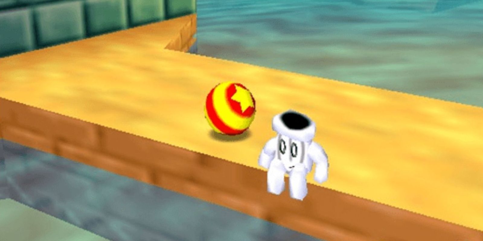 Glover sitting on an edge with his ball in Glover N64