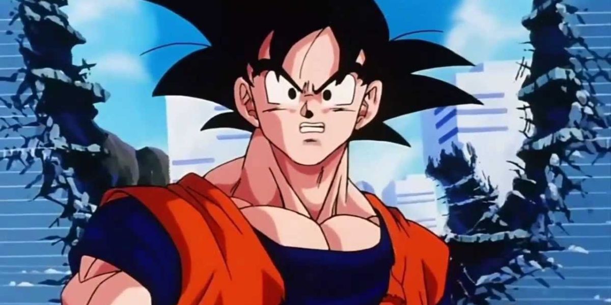 Goku standing in front of a hole in the wall in Dragon Ball