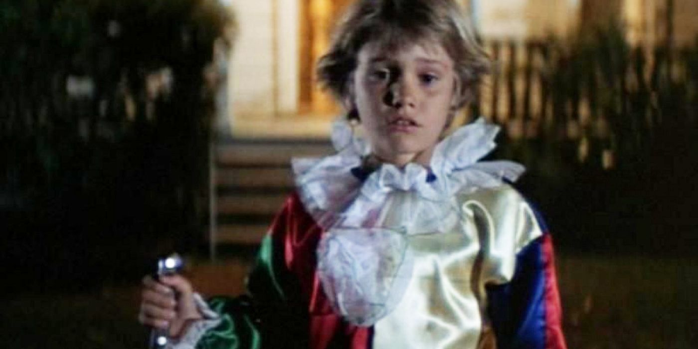 Young Michael holding a knife in costume in Halloween