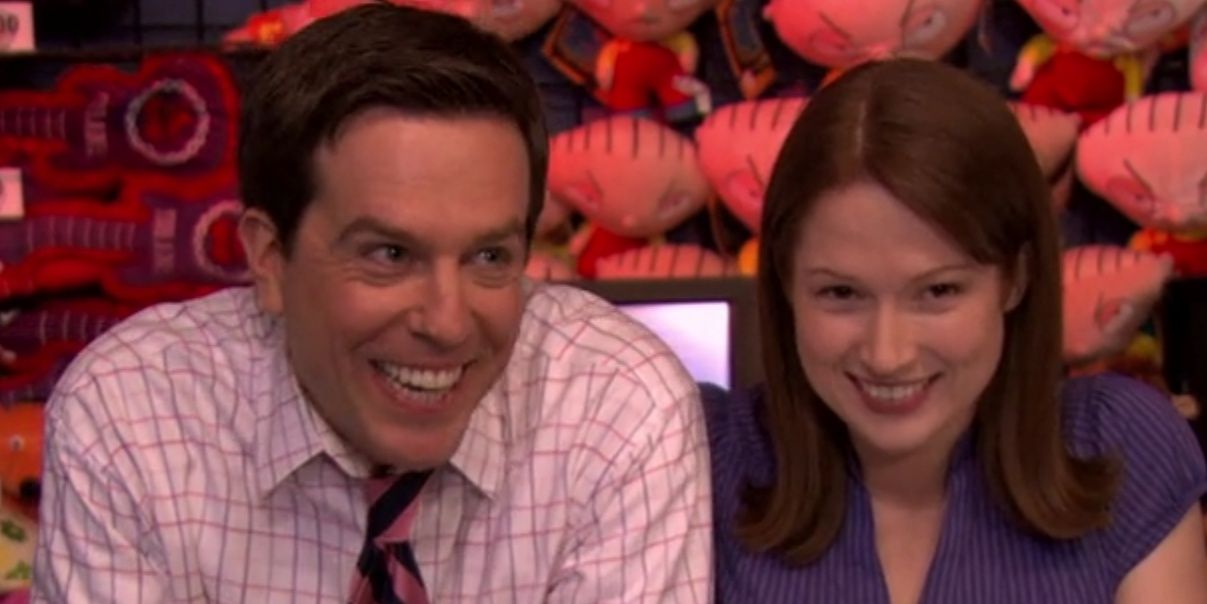 An image of Andy and Erin smiling at the camera in The Office