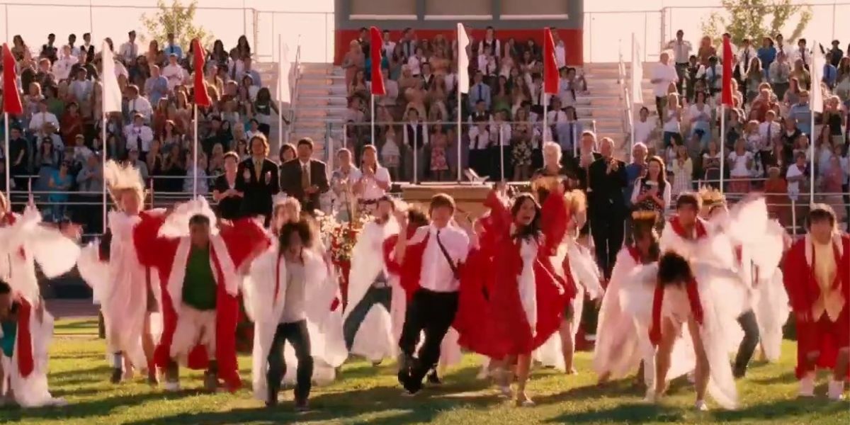 Troy, Gabriella, and the rest of the cast dancing and singing at graduation in the final scene