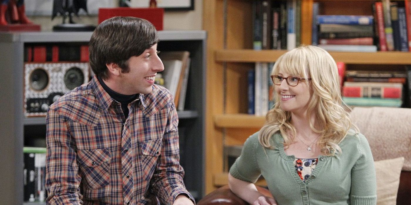 Howard and bernadette smiling while at Leonard and Sheldon's apartment in The Big Bang Theory
