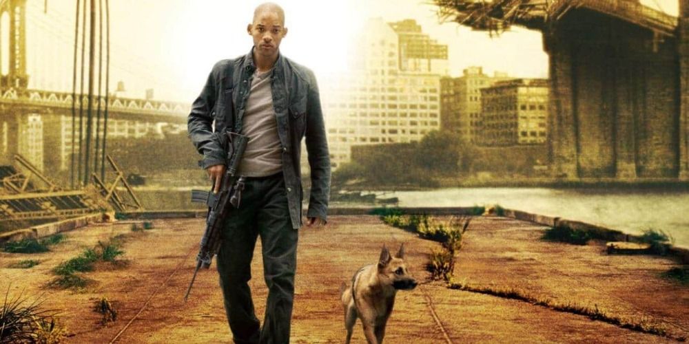 Robert Neville and his dog walking down a deserted road in I Am Legend